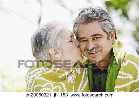 Middle-aged couple kissing View Large Photo Image Stock Image - Middle-aged couple kissing. Fotosearch