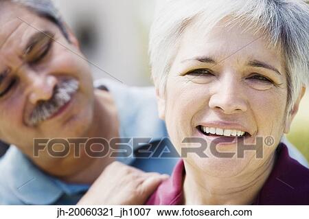 Stock Photo - Middle-aged couple smiling. Fotosearch