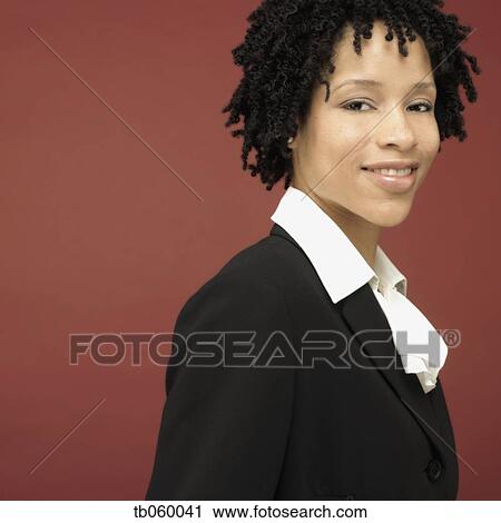 Studio shot of African businesswoman smiling View Large Photo Image Stock Image - Studio shot of African businesswoman smiling. Fotosearch