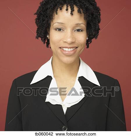 Studio shot of African businesswoman smiling View Large Photo Image Stock Image - Studio shot of African businesswoman smiling. Fotosearch