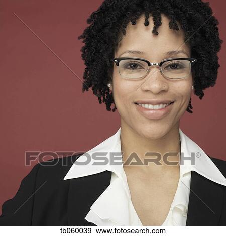 Studio shot of African businesswoman smiling View Large Photo Image Stock Photo - Studio shot of African businesswoman smiling. Fotosearch