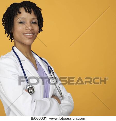 Studio shot of female African doctor View Large Photo Image Stock Image - Studio shot of female African doctor. Fotosearch