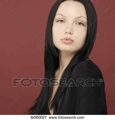 Stock Photo - Studio shot of woman posing. Fotosearch