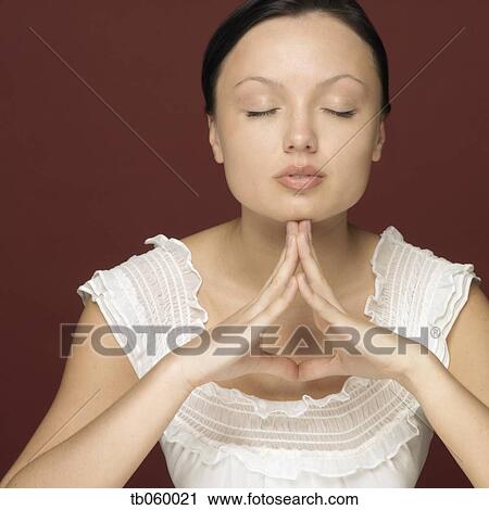 Studio shot of woman with eyes closed View Large Photo Image Stock Image - Studio shot of woman with eyes closed. Fotosearch