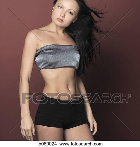 Picture - Studio shot of woman with hair blowing. Fotosearch