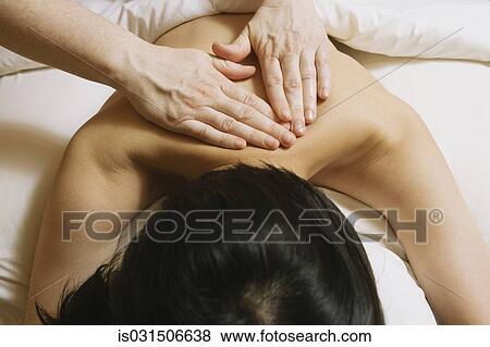Stock Photo - Woman receiving massage. Fotosearch