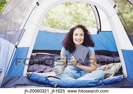 Woman with coffee in tent View Large Photo Image Stock Photography - Woman with coffee in tent. Fotosearch