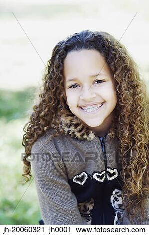 Young African girl with braces smiling View Large Photo Image Stock Image - Young African girl with braces smiling. Fotosearch