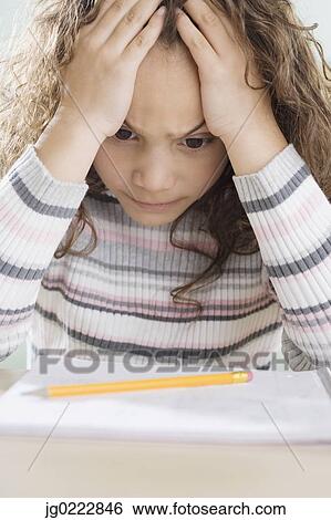 Young girl thinking about homework View Large Photo Image Stock Photograph - Young girl thinking about homework . Fotosearch