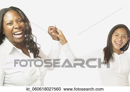 African mother and daughter holding hands and smiling View Large Photo Image Stock Image - African mother and daughter holding hands and smiling. Fotosearch