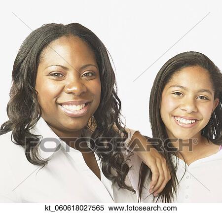 African mother and daughter smiling View Large Photo Image Stock Photography - African mother and daughter smiling. Fotosearch