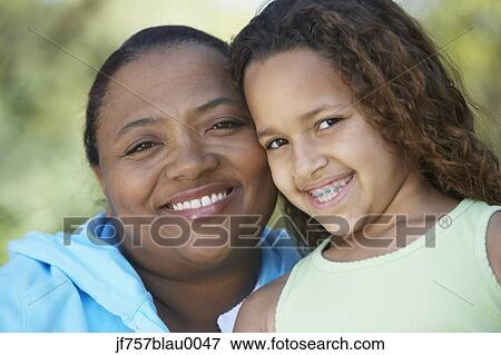 African mother and daughter with braces smiling View Large Photo Image Stock Photo - African mother and daughter with braces smiling. Fotosearch