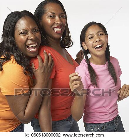 African mother and daughters laughing and hugging View Large Photo Image Stock Image - African mother and daughters laughing and hugging. Fotosearch