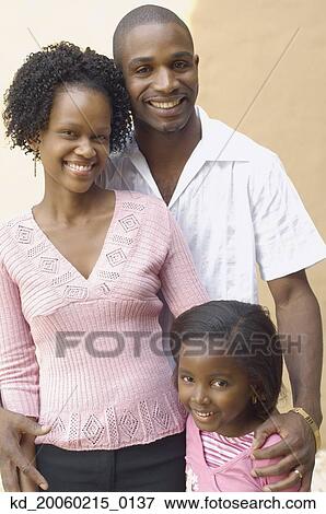 Stock Photo - African parents with young daughter smiling. Fotosearch