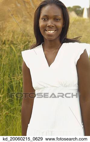 African woman smiling outdoors View Large Photo Image Stock Photo - African woman smiling outdoors. Fotosearch