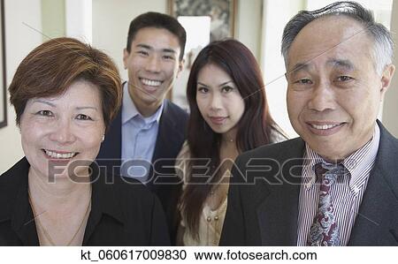 Asian family smiling indoors View Large Photo Image Stock Image - Asian family smiling indoors. Fotosearch