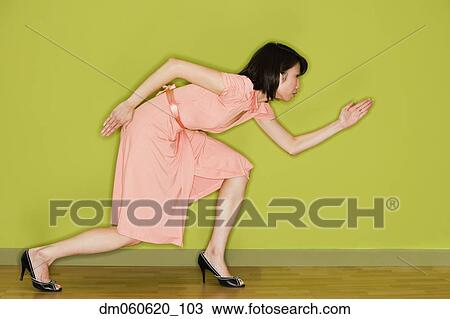 Asian woman in dress doing martial arts move View Large Photo Image Stock Image - Asian woman in dress doing martial arts move . Fotosearch