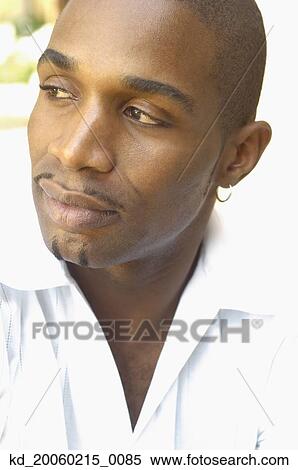 Close up of African man wearing earring View Large Photo Image Stock Photography - Close up of African man wearing earring. Fotosearch