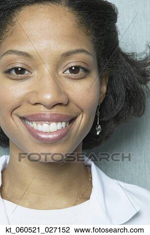 Close up of African woman smiling View Large Photo Image Stock Image - Close up of African woman smiling. Fotosearch