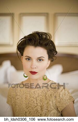 Close up of woman with hair up wearing red lipstick View Large Photo Image Stock Photograph - Close up of woman with hair up wearing red lipstick. Fotosearch