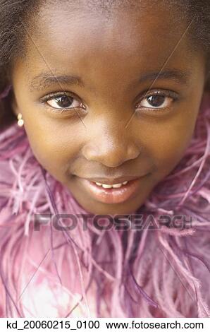 Close up of young African girl smiling View Large Photo Image Stock Image - Close up of young African girl smiling. Fotosearch