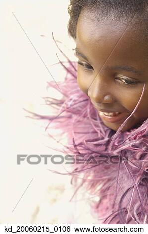 Close up of young African girl smiling View Large Photo Image Stock Photograph - Close up of young African girl smiling. Fotosearch