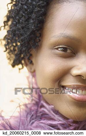 Close up of young African woman smiling View Large Photo Image Stock Photo - Close up of young African woman smiling. Fotosearch