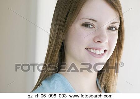 Stock Image - Close up of young woman smiling. Fotosearch