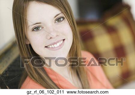 Stock Image - Close up of young woman smiling. Fotosearch