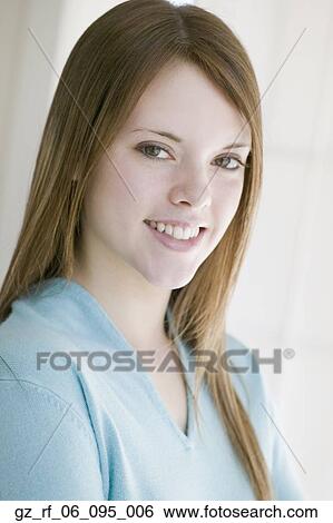 Stock Photograph - Close up of young woman smiling. Fotosearch