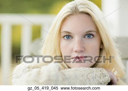 Close up of young woman wearing sweater View Large Photo Image Stock Photography - Close up of young woman wearing sweater. Fotosearch