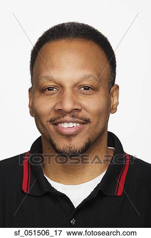 Close up studio shot of African man smiling View Large Photo Image Stock Photo - Close up studio shot of African man smiling. Fotosearch