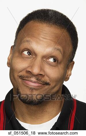 Close up studio shot of African man smiling and looking up View Large Photo Image Stock Photo - Close up studio shot of African man smiling and looking up. Fotosearch