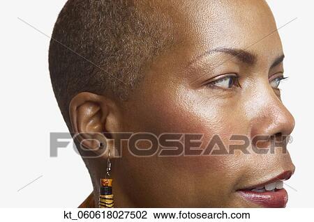 Stock Image - Close up studio shot of middle-aged African woman . Fotosearch