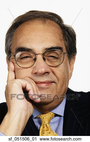 Stock Image - Close up studio shot of middle-aged businessman. Fotosearch