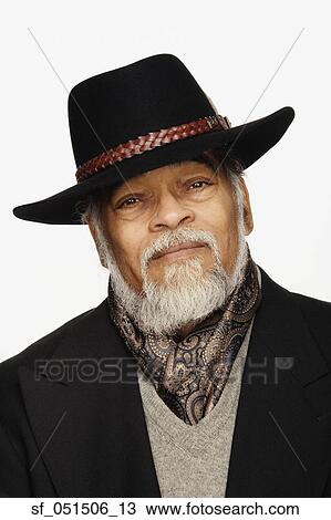 Close up studio shot of senior African man wearing hat View Large Photo Image Stock Image - Close up studio shot of senior African man wearing hat. Fotosearch