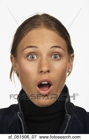 Close up studio shot of woman looking surprised View Large Photo Image Stock Photo - Close up studio shot of woman looking surprised. Fotosearch