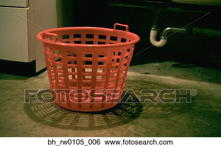 Empty laundry basket on floor in basement View Large Photo Image Stock Photograph - Empty laundry basket on floor in basement. Fotosearch