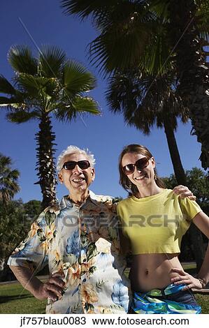 Father and adult daughter hugging outdoors View Large Photo Image Stock Image - Father and adult daughter hugging outdoors. Fotosearch