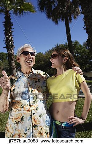Father and adult daughter hugging outdoors View Large Photo Image Stock Photo - Father and adult daughter hugging outdoors. Fotosearch