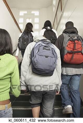 Group of students walking up stairs at school View Large Photo Image Stock Image - Group of students walking up stairs at school. Fotosearch