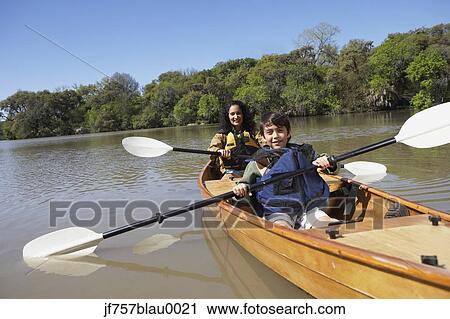 Hispanic mother and son paddling canoe View Large Photo Image Stock Image - Hispanic mother and son paddling canoe . Fotosearch