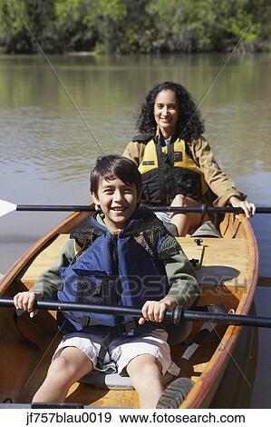 Hispanic mother and son sitting in canoe View Large Photo Image Stock Photo - Hispanic mother and son sitting in canoe . Fotosearch