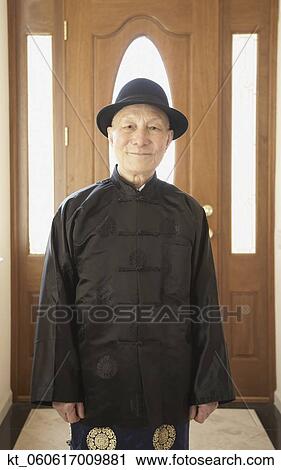 Senior Asian man smiling in traditional dress View Large Photo Image Stock Image - Senior Asian man smiling in traditional dress. Fotosearch