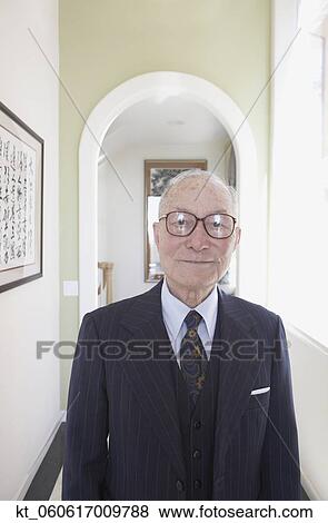Senior man wearing suit in hallway View Large Photo Image Stock Photo - Senior man wearing suit in hallway. Fotosearch