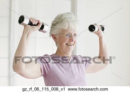 Senior woman lifting free weights View Large Photo Image Stock Image - Senior woman lifting free weights. Fotosearch