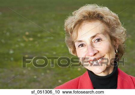 Stock Image - Senior woman smiling outdoors. Fotosearch