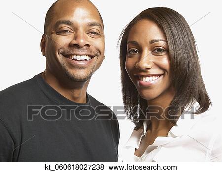 Studio shot of African couple smiling View Large Photo Image Stock Photo - Studio shot of African couple smiling. Fotosearch