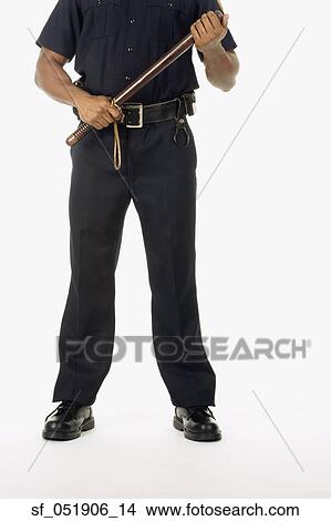 Picture - Studio shot of African male police officer. Fotosearch