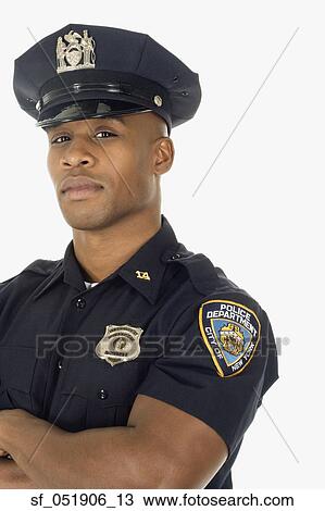 Stock Image - Studio shot of African male police officer. Fotosearch